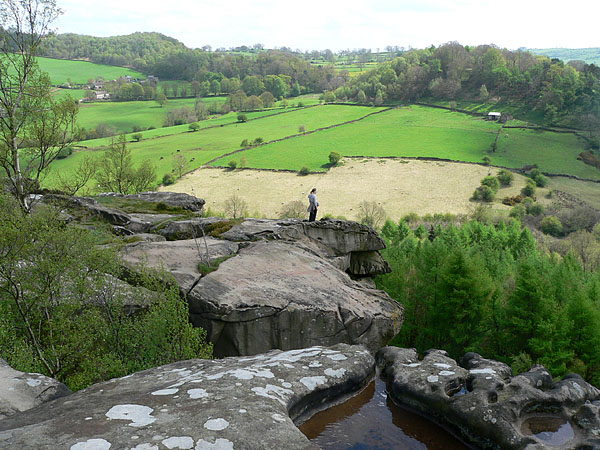 From Cratcliffe towards Birchover. This area is mainly open farmland with a few small coppices and is shown here from Cratcliffe Tor. Cratcliffe is renowned for good climbing and t