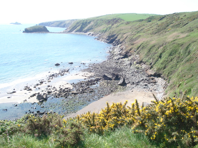 Porth Ysgo beach Low tide reveals this small beach which is reached by a very steep climb down from this point.