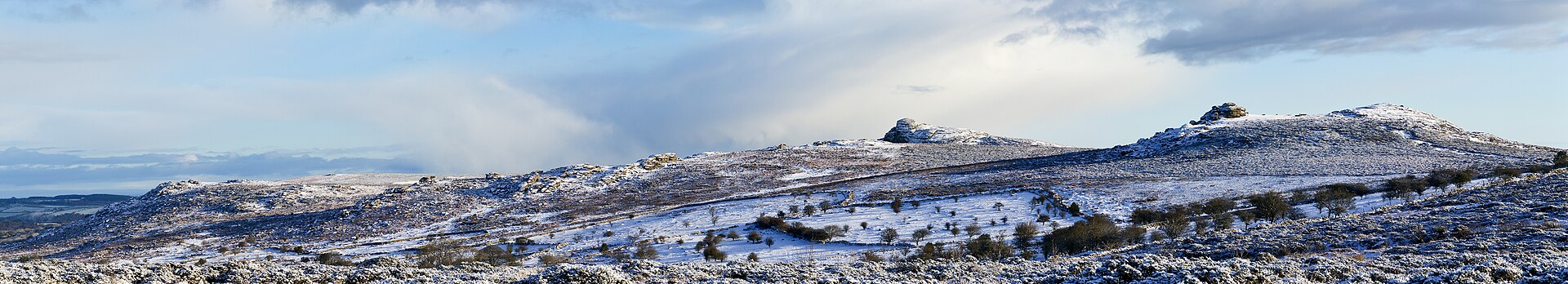 A panorama showing some of Dartmoor's tors in snow. The nearest on the right is Saddle tor (the derivation of the name is obvious) and Hay tor, one of Dartmoor's best known just to